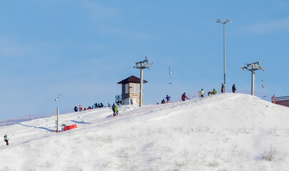 roof covered with snow against the blue sky