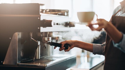 Professional barista streaming and making coffee at cafe, Small business owner preparing hot drink for customer.