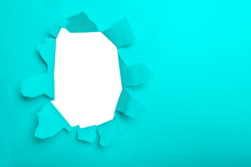 a hole in turquoise paper