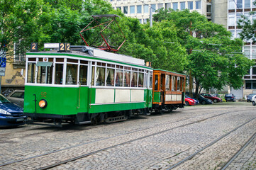 Fototapeta na wymiar Vintage green tram from early 20 century on the streets of Sofia Bulgaria.