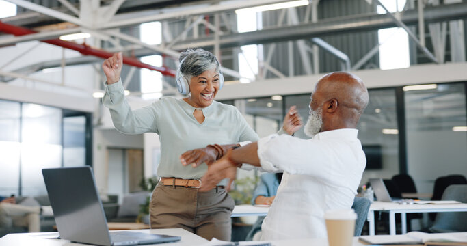 Dancing, office and group of business people with headphones having fun, happy and good mood at work. Success, team and excited workers dance, listening to music and high five in corporate workplace
