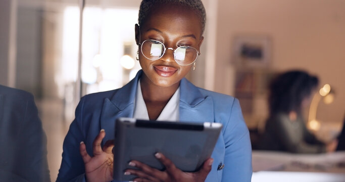 Black woman, tablet and business in office at night working overtime, corporate deadline or online research. Social media, internet surfing and female from Nigeria on digital tech in dark office.