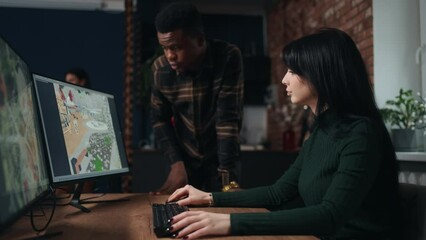 african man and caucasian woman architects creating new landscape design in CAD system