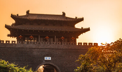 The sunset at Dong Guan ancient city wall, the chinese characters in the pictures translated as...