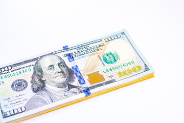 Group of money dollar banknotes arranged on white background and space for text. Dollar banknotes isolated on white background. Exchange money, Money, Cash, finances and Travel concept.