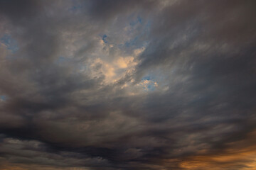 Naklejka na ściany i meble Dramatic sky with clouds at sunset or sunrise. Storm or weather forecast concept