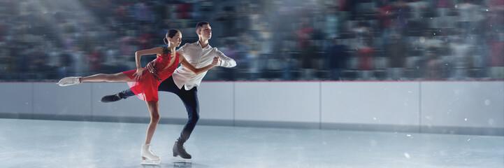 Young girl iand boy performing on championship, professional figure skaters in beautiful stage costumesskating. Concept of sport, achievements, competition, art, talent. 3D arena, ice rink © master1305