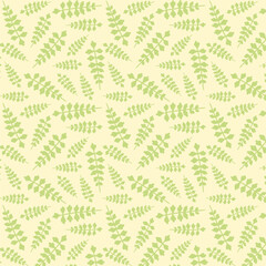 Green leaves on the yellow background. Decorative seamless pattern for wrapping paper, wallpaper, textile, greeting cards and invitations.