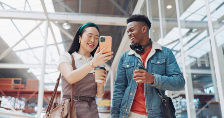 Shopping mall, smartphone and couple of friends on social media, website or blog for discount, sales and travel communication. Diversity gen z people walking, using phone or cellphone and coffee cup