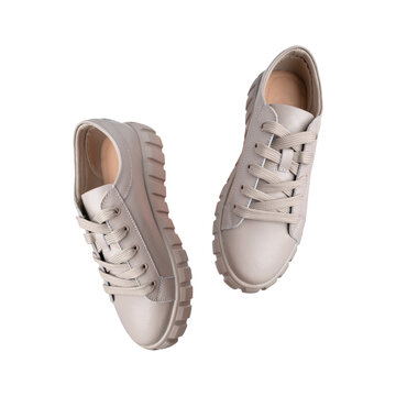 Beige Gray Leather Female Sneakers With Lace Isolated On White Background. With Clipping Path. Flying Fashion Casual Sneakers, Sports Unisex Clothing Shoes. Minimal Mockup With Footwear