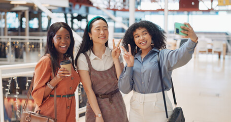Selfie, friends and social media with woman together posing for a photograph in a mall or shopping center. Phone, social media and smile with a happy female friend group taking a picture for fun