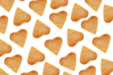 Shortbread cookies in the form of hearts on a white background. Valentine's Day pattern. Flat lay