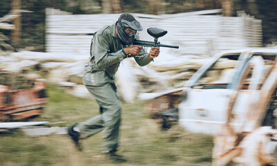 Paintball, speed or man running in a shooting game playing with fast war action on a fun battlefield. Mission focus, military or guy with a gun or weapon gear for survival in an outdoor competition