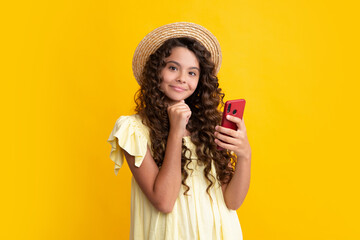 Teenage girl with smart phone. Portrait of teen child using mobile phone, cell web app. Happy teenager, positive and smiling emotions of teen girl.