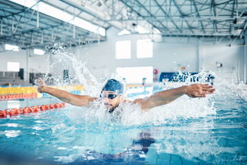Man, breathing or butterfly stroke in swimming pool cap for sports wellness, training or exercise...