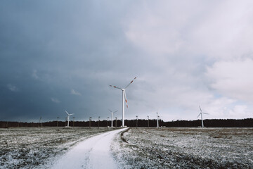 windmill farm or wind park, with high wind turbines for generation electricity.