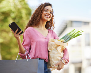 Smartphone, woman and shopping with bags, outdoor and purchase groceries with smile, sale and discount items. Female shopper, customer and lady with online deals, waiting for taxi and retail products