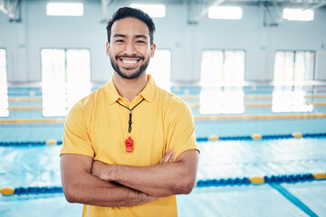 Portrait, proud and coach at a swimming pool for training, exercise and practice at indoor center....