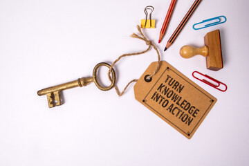 Turn Knowledge Into Action. Gold key with price tag