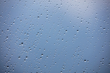 rainy days , rain drops on the window surface