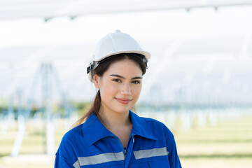 Close up of female engineer worker wear safety helmet and uniform working outdoor