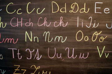 alphabet written on blackboard