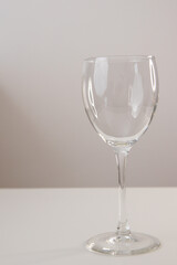 transparent wine glass on a light background