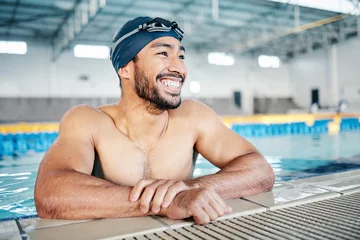Poster Happy athlete, relax or pool swimmer with cap or goggles in sports wellness, training or exercise for body muscle. Workout, fitness or swimming man with smile, water competition goals or healthcare © Clayton D/peopleimages.com