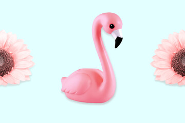 Creative composition with ceramic flamingo and flowers. Pastel blue background.