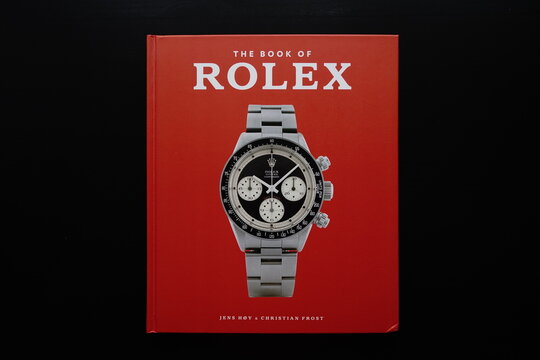 Rolex book with an illustration of a Rolex watch on cover, Moscow, Russia - November 23, 2020
