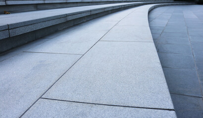 Granite tiles stairway curved shape outdoor.