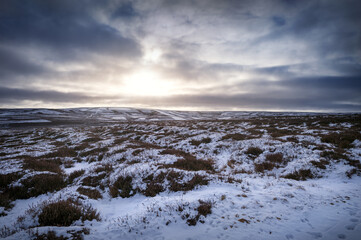 The frozen snow covered hills, countryside at sunrise of Muggleswick and Edmondbyers common, moor in winter near Blanchland, Northumberland  in England UK.