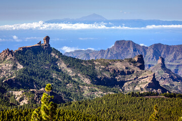 Magestic view from El Pico de las Nieves viewpoint of Roque Nublo and Teide peak at Roque Nublo Rural Park, Gran Canary, Canary Islands, Spain - obrazy, fototapety, plakaty