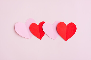 Red and Pink Paper Hearts on pink background, Heart shape papercut , Happy Valentine's day