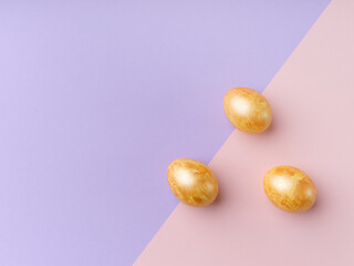 Flat lay with colored easter eggs on bright background. Creative template for festive content