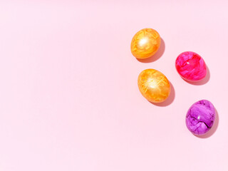 Creative layout with colored easter eggs on bright background. A template for festive content
