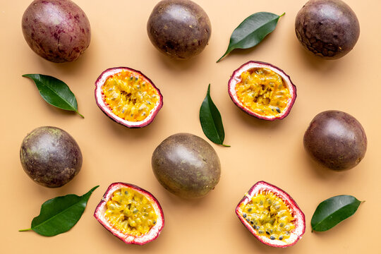 Flatlay of whole and half of fresh passion fruit - marakuya