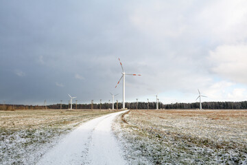 windmill farm or wind park, with high wind turbines for generation electricity.