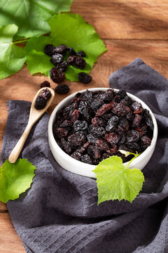 Healthy Food - Nuts Dehydrated Grapes; Photo On Wooden Background