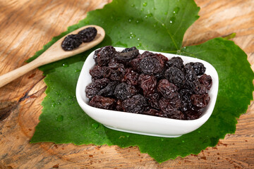 Healthy Food - Nuts Dehydrated Grapes; Photo On Wooden Background