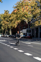 Man Riding Bike in Street