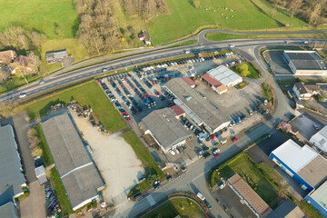 Aerial view of goods warehouses and logistics center in industrial city zone from above