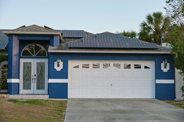 Wide garage double door and concrete driveway of new modern american house