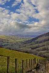 Naklejka premium In Nidderdale, England, UK, steep, rolling hills lead to a valley that is enlightened by the morning sun, as it is located in the heart of the Yorkshire Dales.
