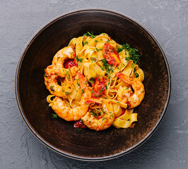 Italian pasta with shrimps in bowl