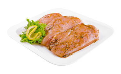 Raw marinated chicken fillet on plate