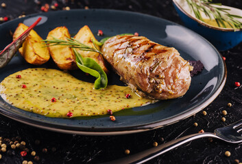 Slices of fried potatoes with chicken steak