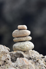 Piles of stones on the beach with a blurred background