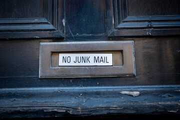 Letter box on front door with 'No Junk Mail' text