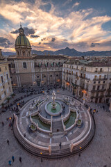 Pretoria square and fountain seen from above at dusk, city of Palermo IT
